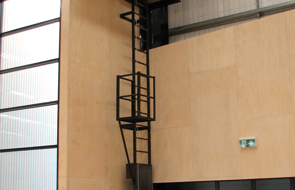 powder-coated-ladder-with-a-vertical-fall-arrest-device-attached