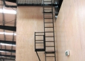 powder-coated-ladder-with-vertical-fall-arrest-device-installed